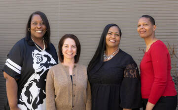 OUSD early childhood educators, Annette Wright, Jacquetta Wallace, Nini Humphrey and Ivonne Garcia stand together